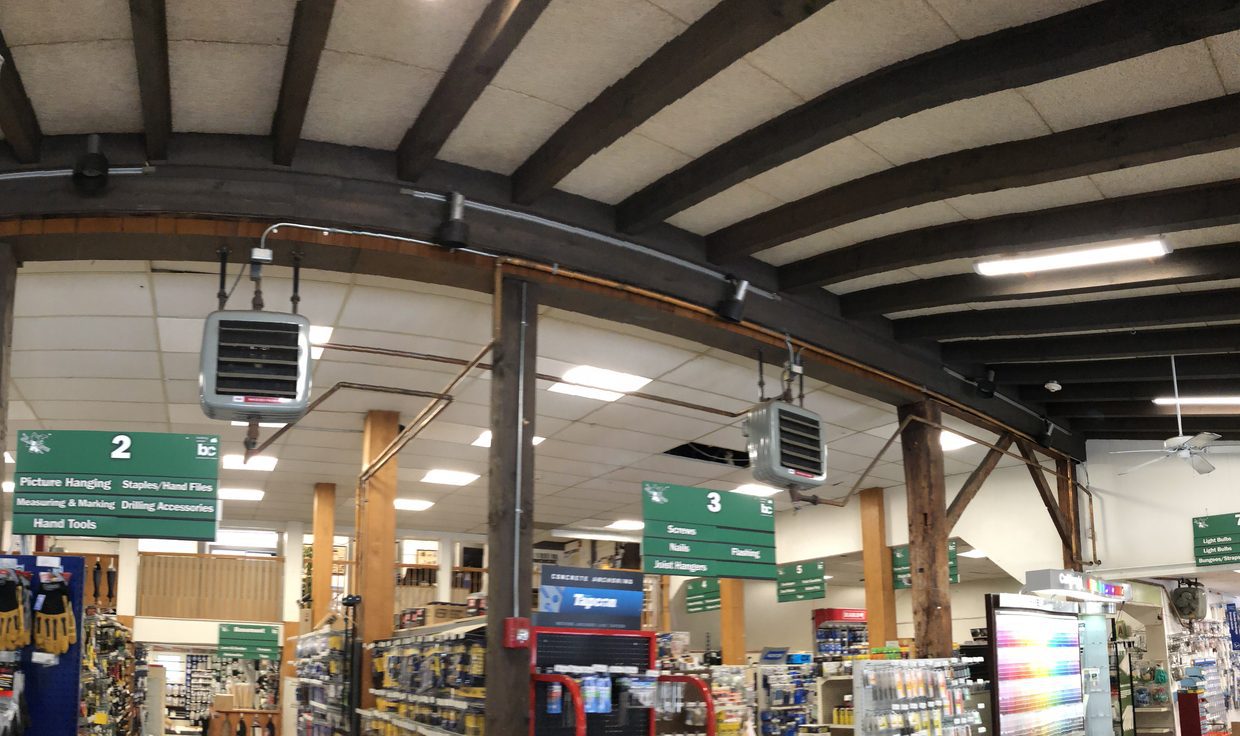 Retail floor of The Building Center under ceiling lights and timber beams, Essex, MA
