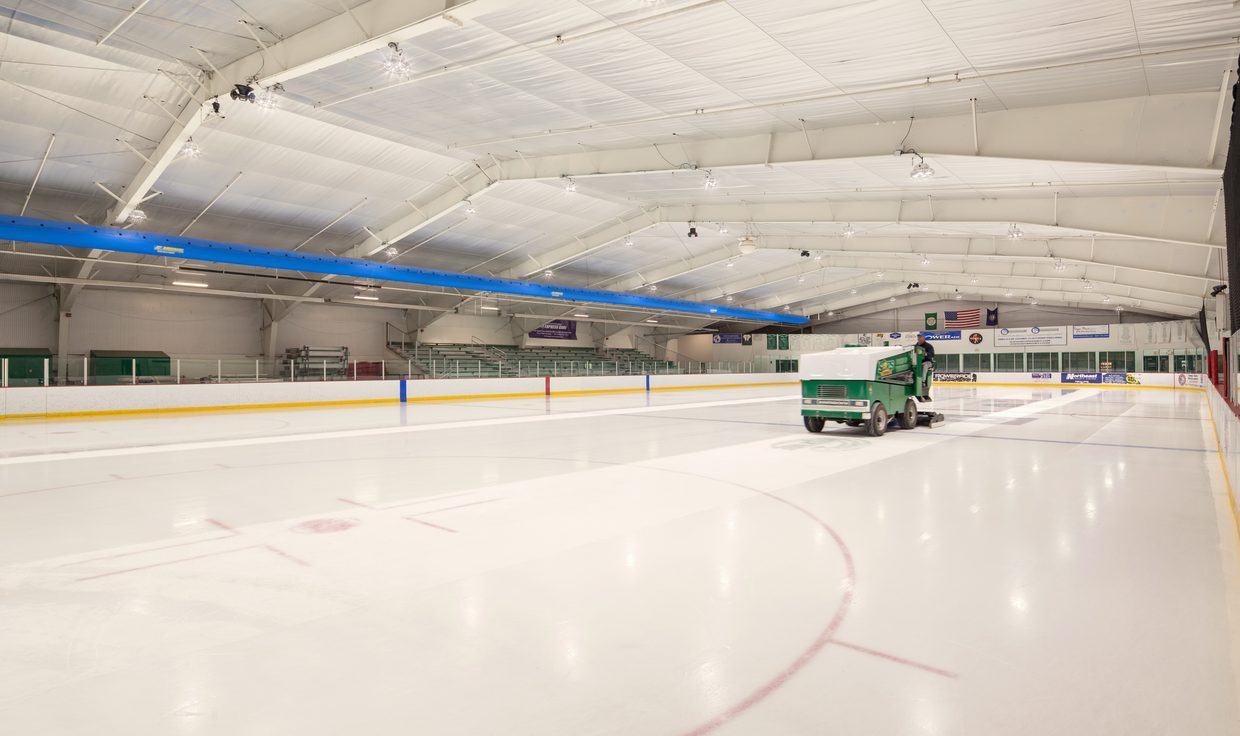 Ice resurfacer crossing the Dover Ice Arena rink under LED fixtures, Dover, NH