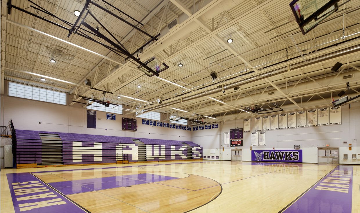 Marshwood High School gymnasium with purple Hawks bleachers under LED fixtures, South Berwick, ME