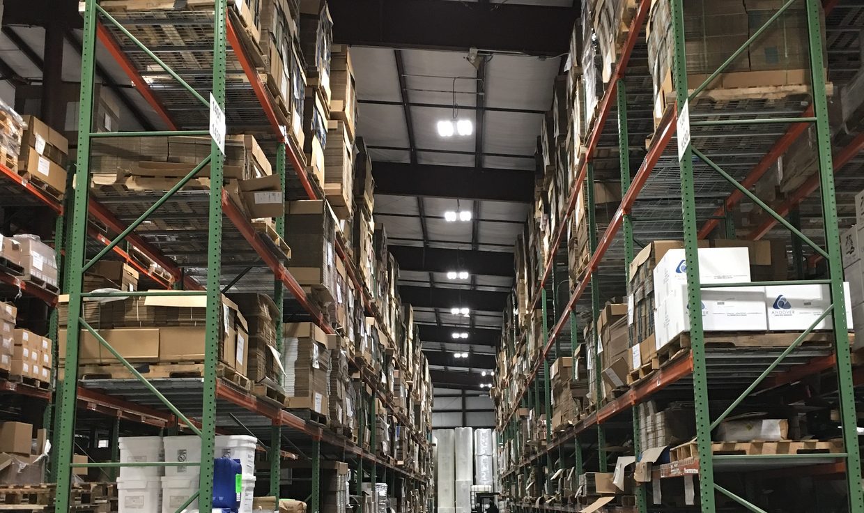 Pallet-racking aisle at Milliken Healthcare under LED high-bay fixtures, Salisbury, MA