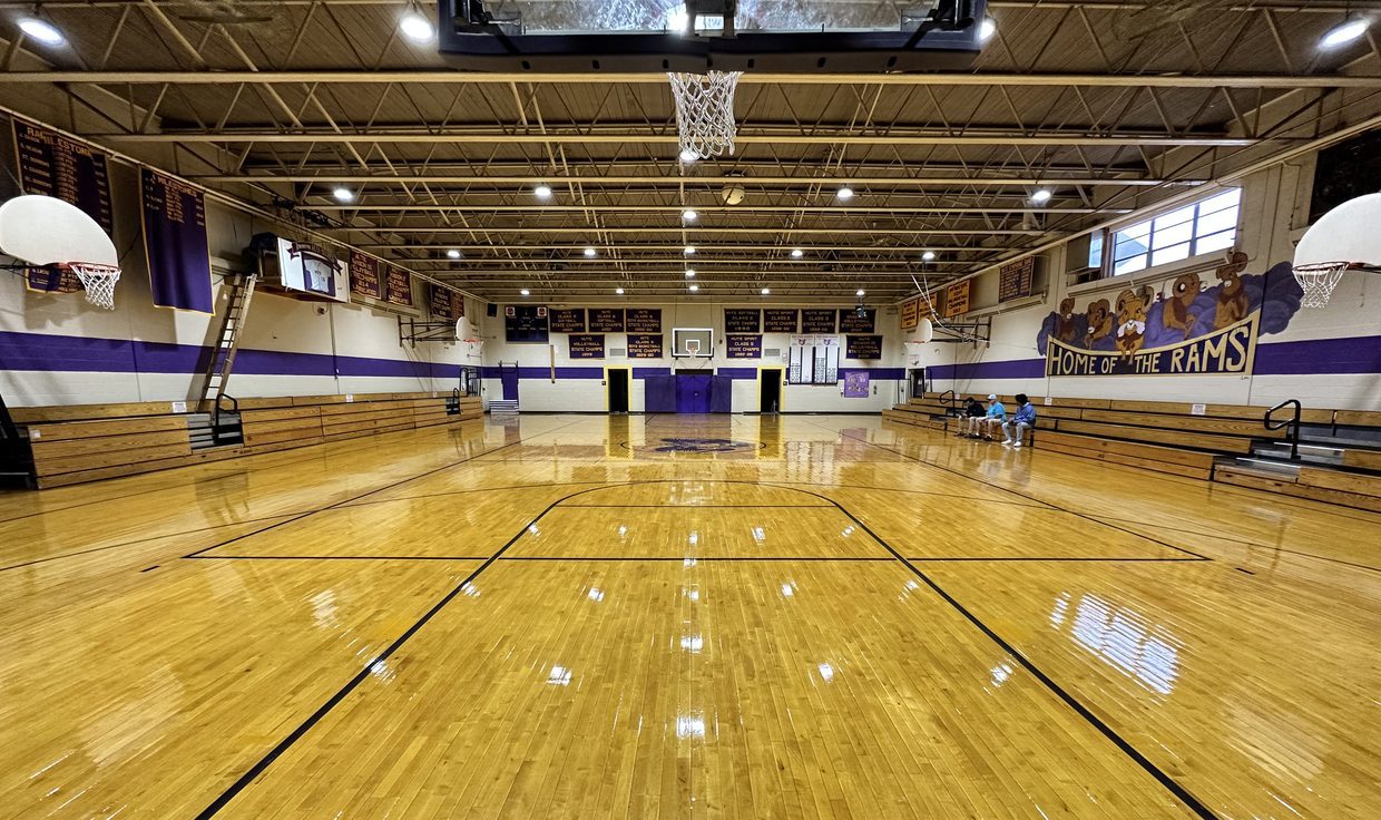 Nute High School gymnasium under round LED high-bay fixtures, Milton, NH