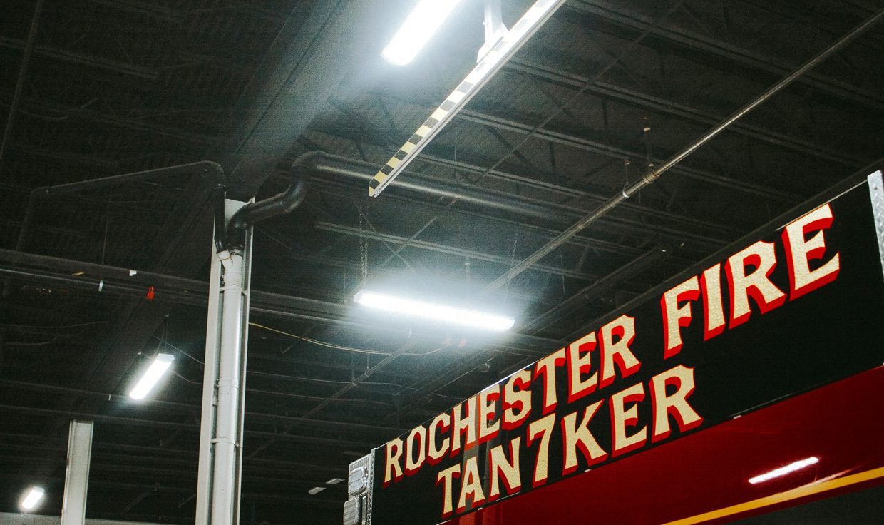 Rochester Fire Department apparatus bay with linear LED fixtures over a tanker truck, Rochester, NH