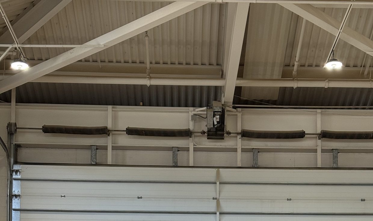 Shop bay at the Sugar River Valley Regional Technical Center with LED high-bay fixtures under the roof trusses, Claremont, NH