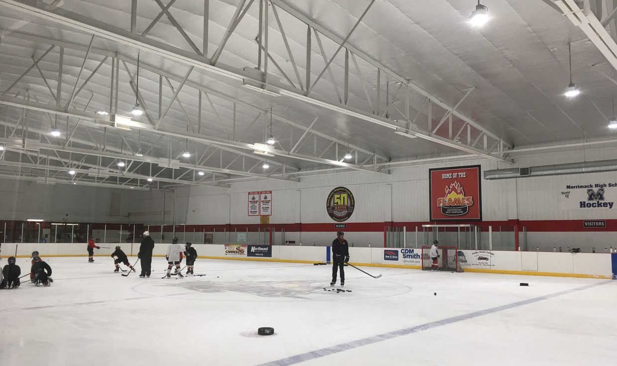 Youth hockey practice at West Side Arena under LED high-bay fixtures, Manchester, NH